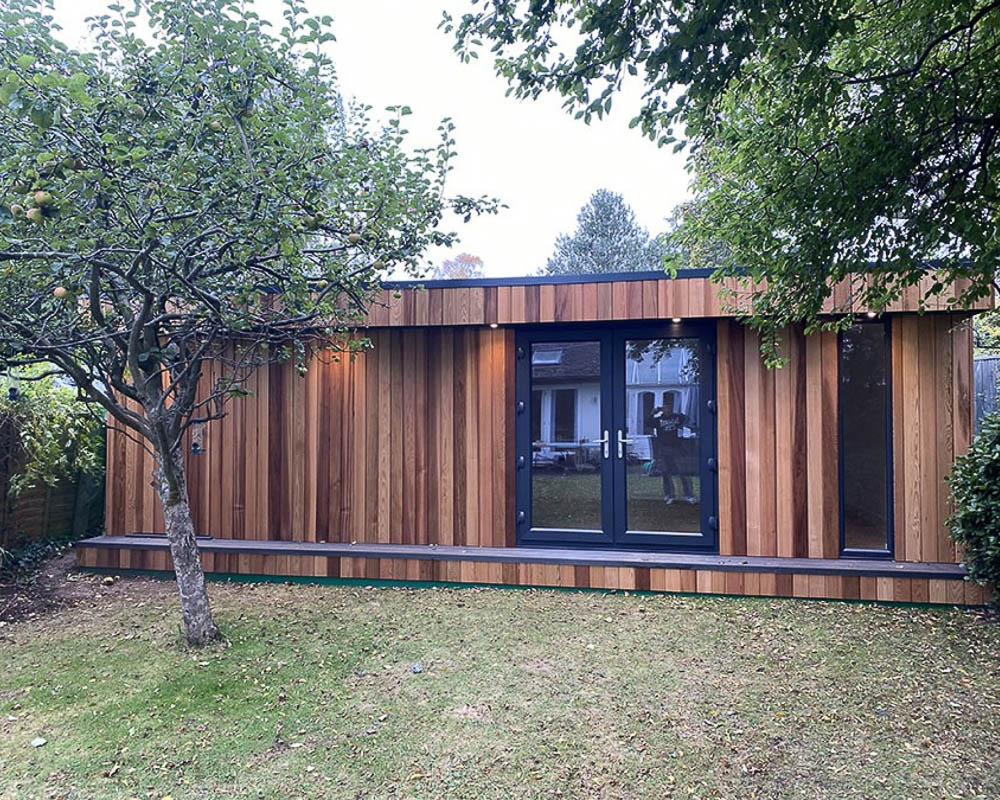 Exterior of a soundproof music room by Garden Spaces