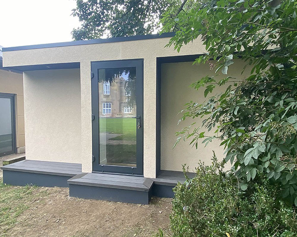 Exterior of a soundproof music room by Garden Spaces