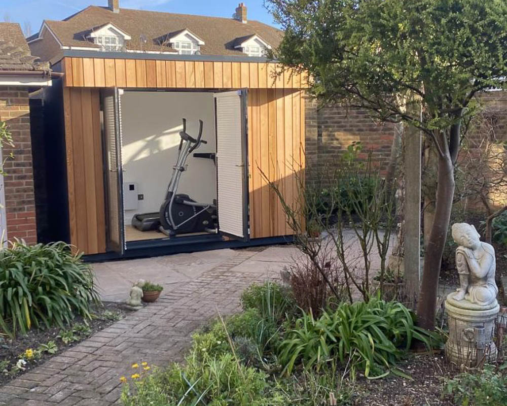 Small Garden Room with Western Red Cedar cladding by Garden Spaces